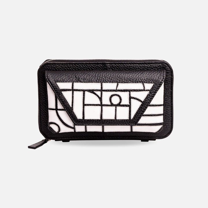 Black and white leather wallet with geometric stitched pattern and front flap pocket on white background