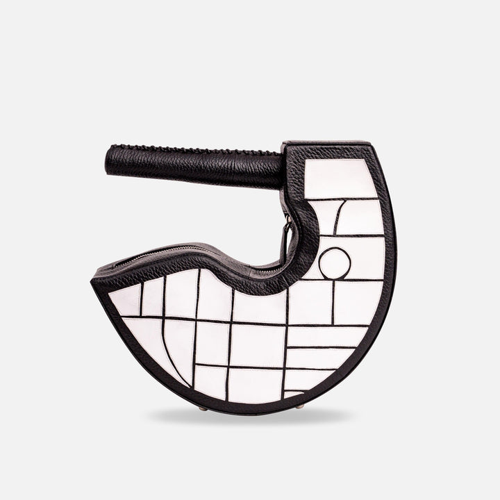 Unique black and white leather handbag with geometric stitch pattern and round handle