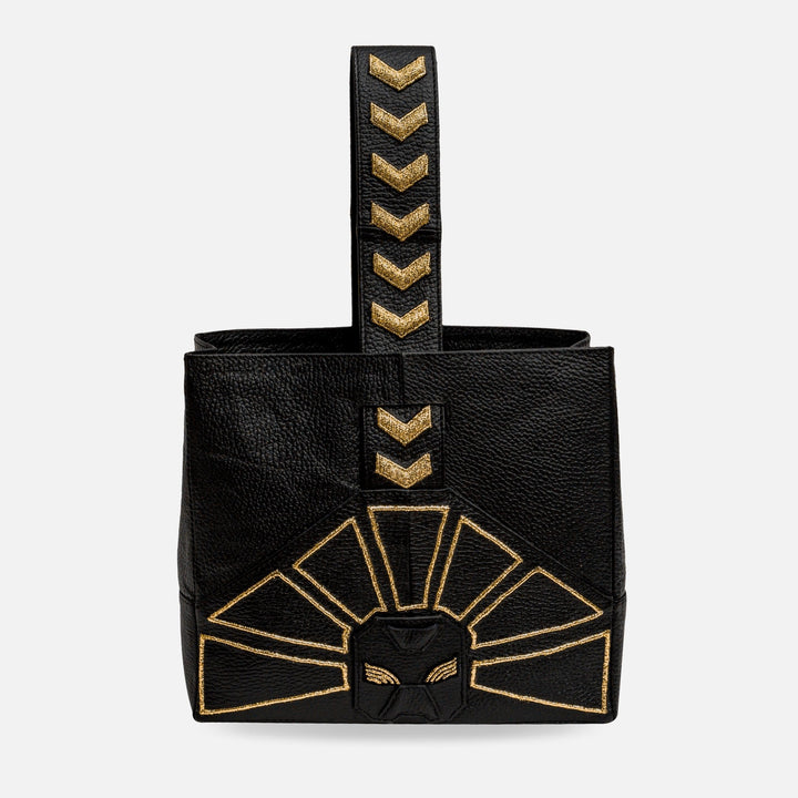 Black leather handbag with gold geometric embroidery and chevron detail on handle