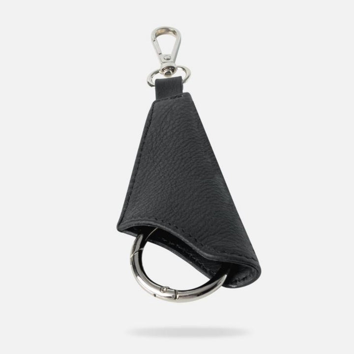 Black upcycled leather keychain with silver attachment loop and metal clip on white background