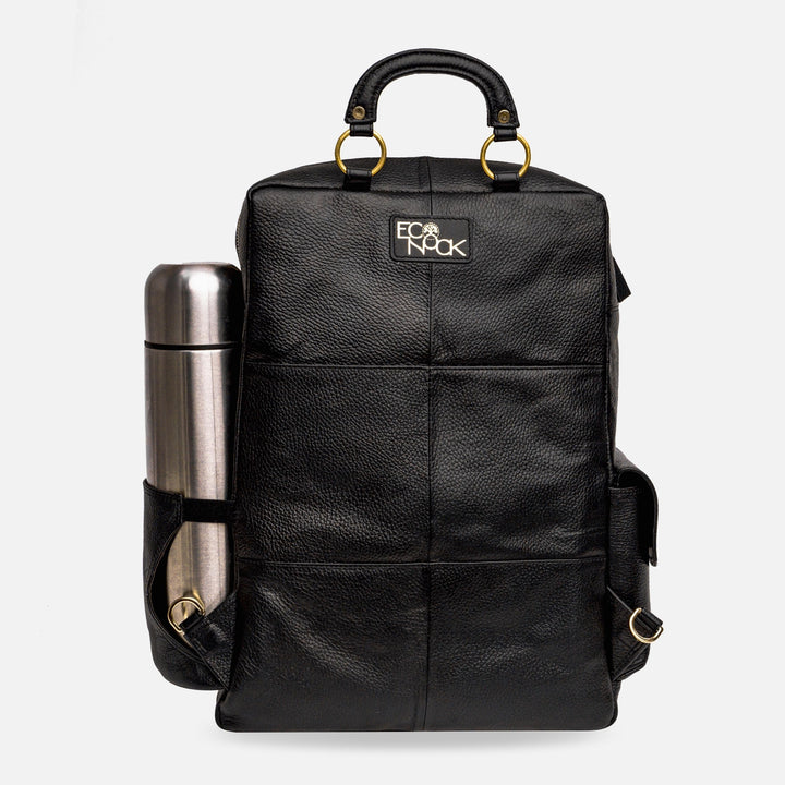 Black leather backpack with gold rings and side pocket holding a silver stainless steel thermos