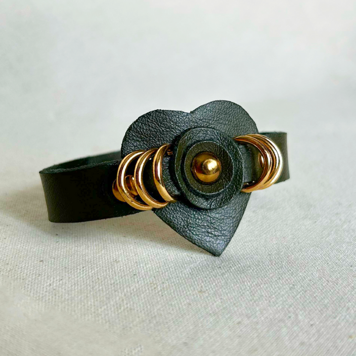 Handcrafted timeless olive green vegan leather cuff bracelet with gold rings and heart detail