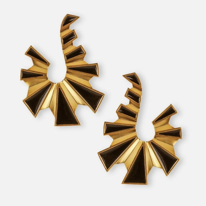 Pair of gold and black enamel metal earrings with geometric fan-shaped design on white background