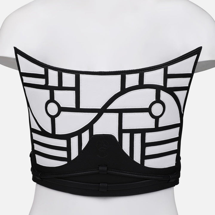 Back view of black and white upcycled leather corset with geometric applique on mannequin