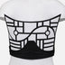 Back view of black and white upcycled leather corset with geometric applique on mannequin