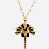Gold and black enamel metal pendant necklace with an abstract tribal design and adjustable gold chain