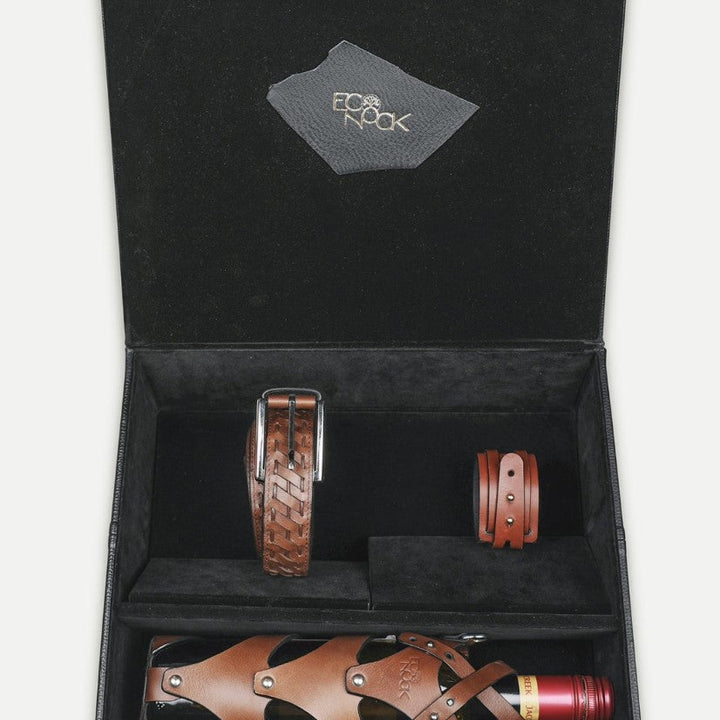 Black gift box with brown leather upcycled belt, bracelet, and wine bottle holder handcrafted in India