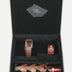 Black gift box with brown leather upcycled belt, bracelet, and wine bottle holder handcrafted in India