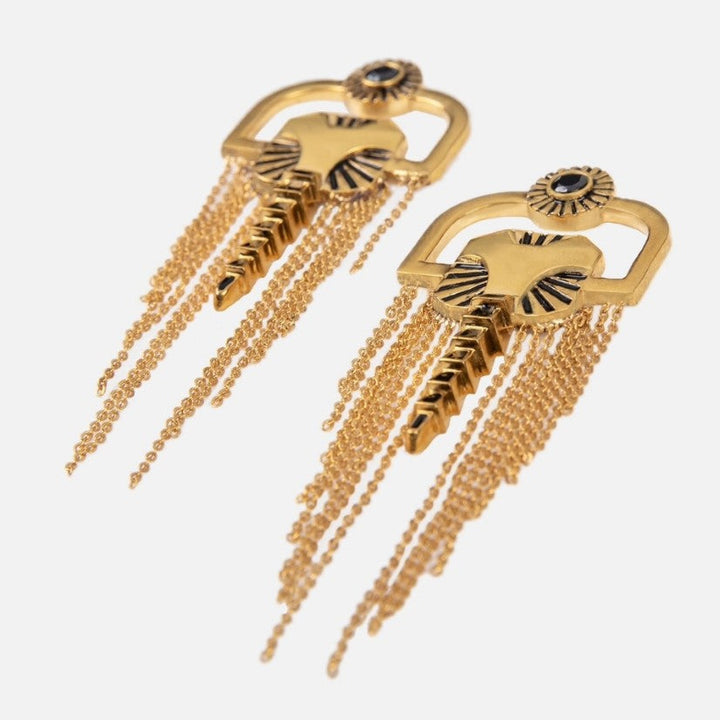 Pair of gold-tone metal earrings with black enamel details and multiple dangling chains on white background