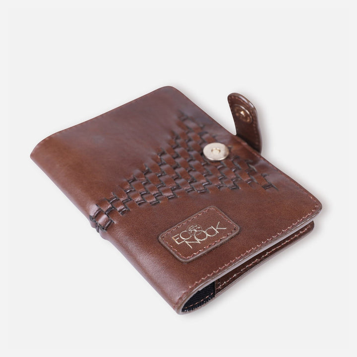 Handcrafted tan leather passport cover with woven detail and EcoNook logo