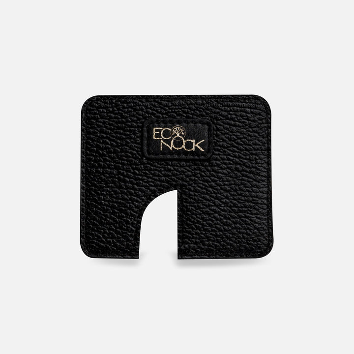 Black textured Eco Nook cardholder with cutout and gold logo on white background