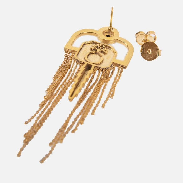 Gold-tone key-shaped earring with chain tassels and post back on white background