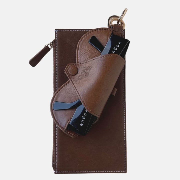 Timeless tan leather Jayden crossbody bag with upcycled belt detail and black Vogue cards