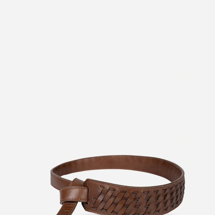 Handcrafted brown leather belt with woven design detail on plain background