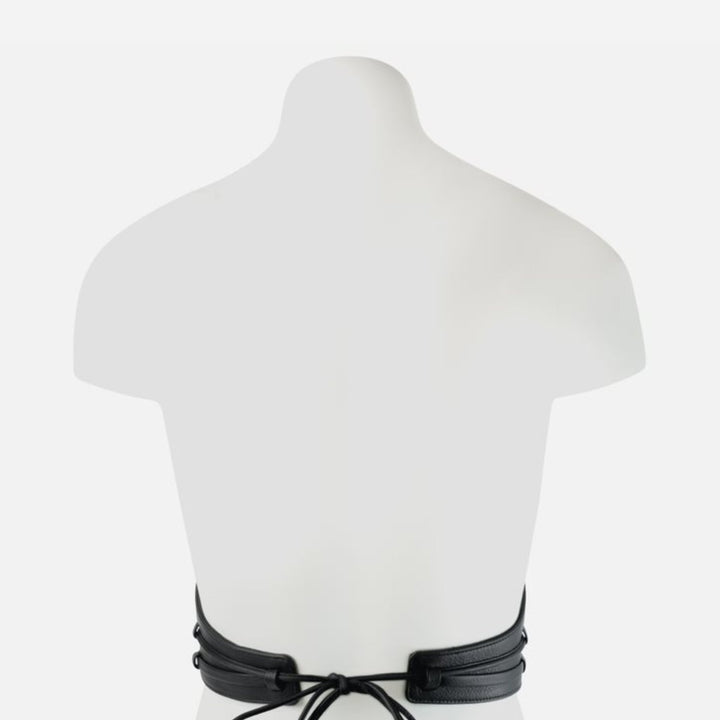 Back view of black leather corset belt tied on white mannequin