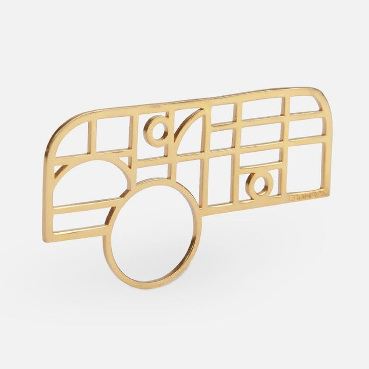 gold metal ring with an abstract geometric grid design on white background