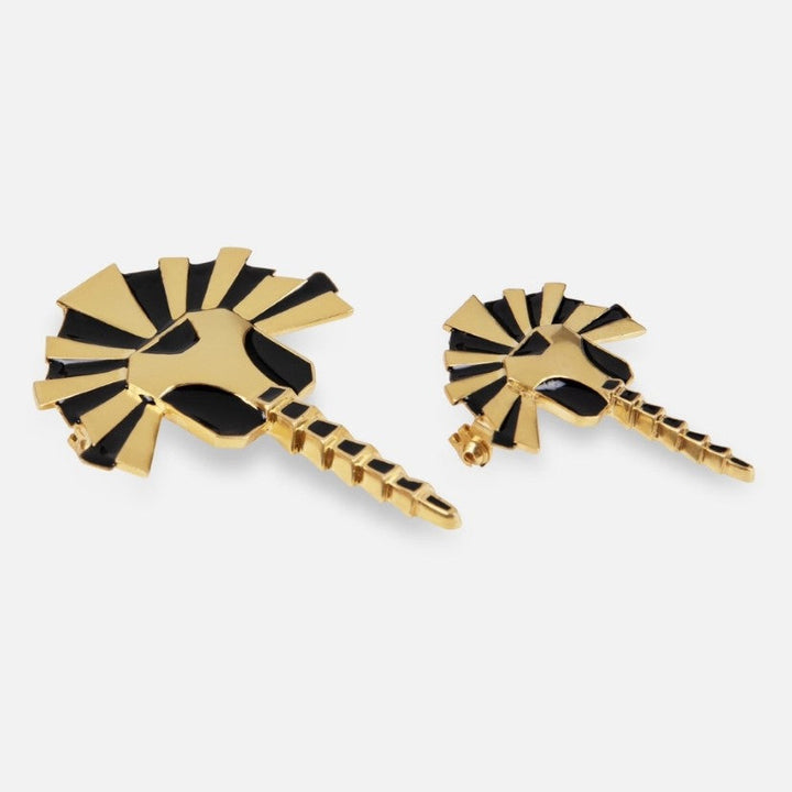 Gold and black enamel handcrafted metal brooches with geometric sunburst and spear design on white background