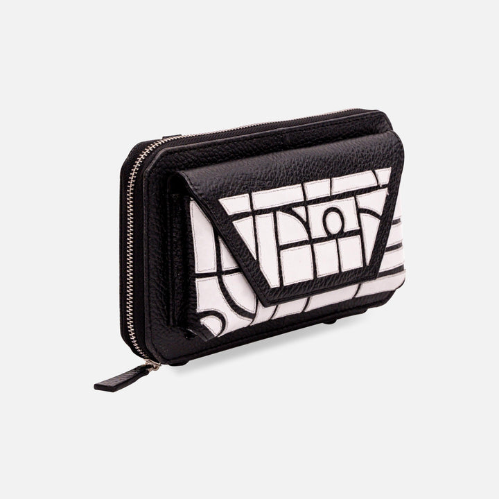Black and white textured leather wallet with geometric pattern and zip closure