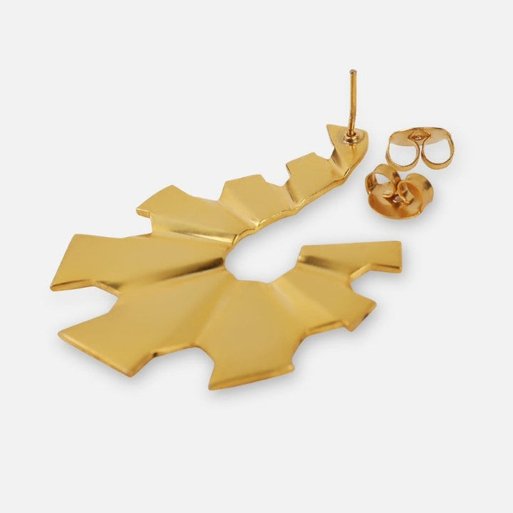 Gold-tone irregular shaped metal stud earring with butterfly back on white background