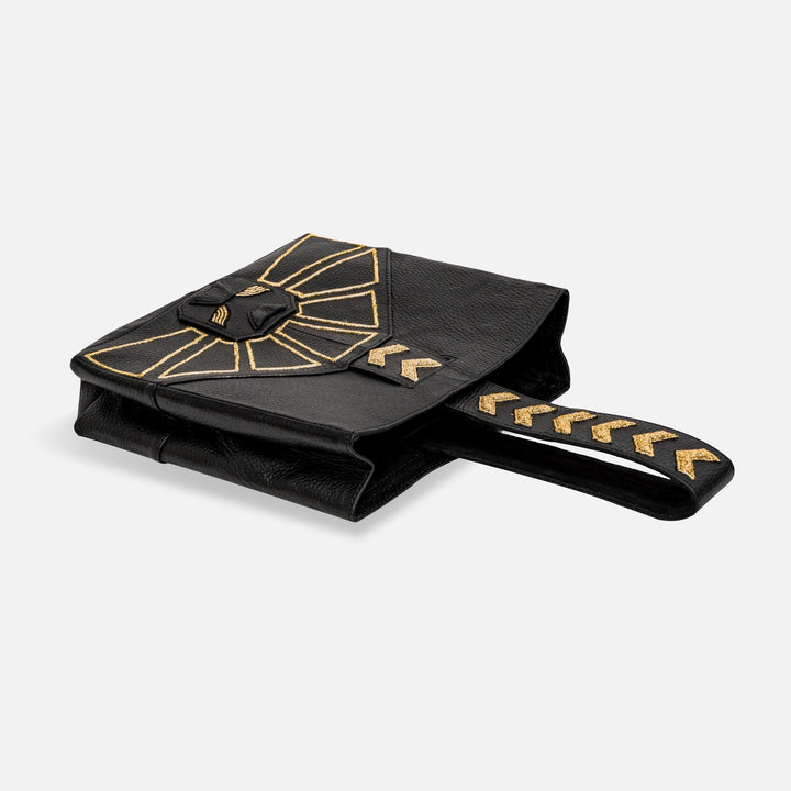 Black leather clutch bag with gold geometric embroidery and matching handle design