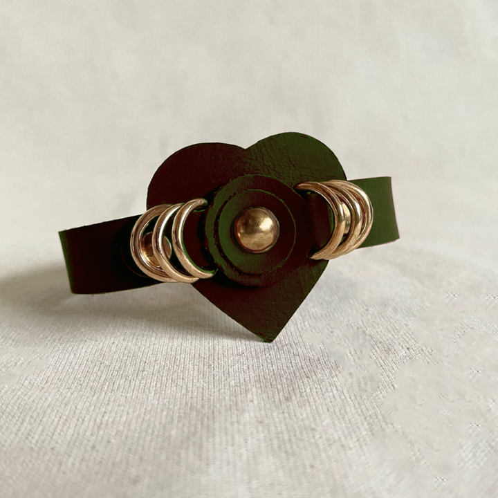 Timeless olive green leather cuff bracelet with gold ring studs, handcrafted women's accessory