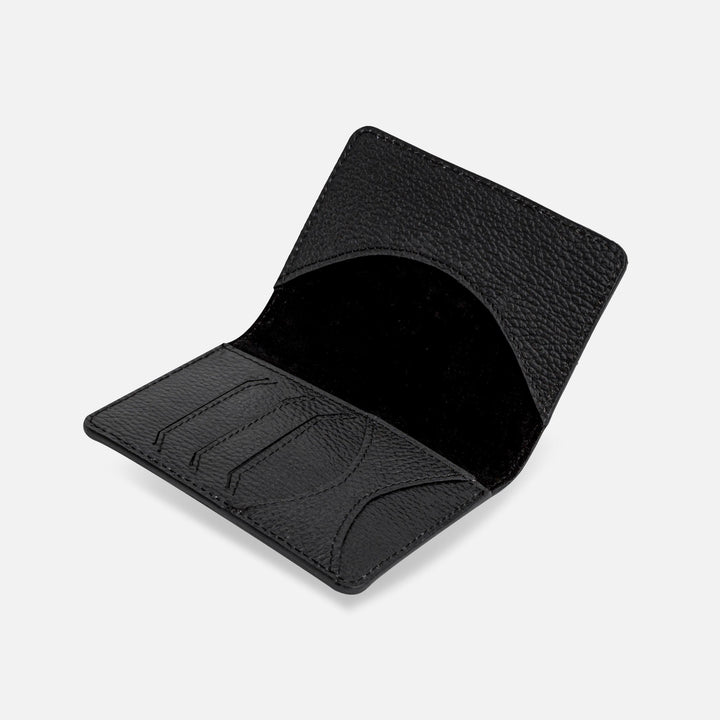 Open black textured leather card holder wallet with three card slots and curved inner pocket